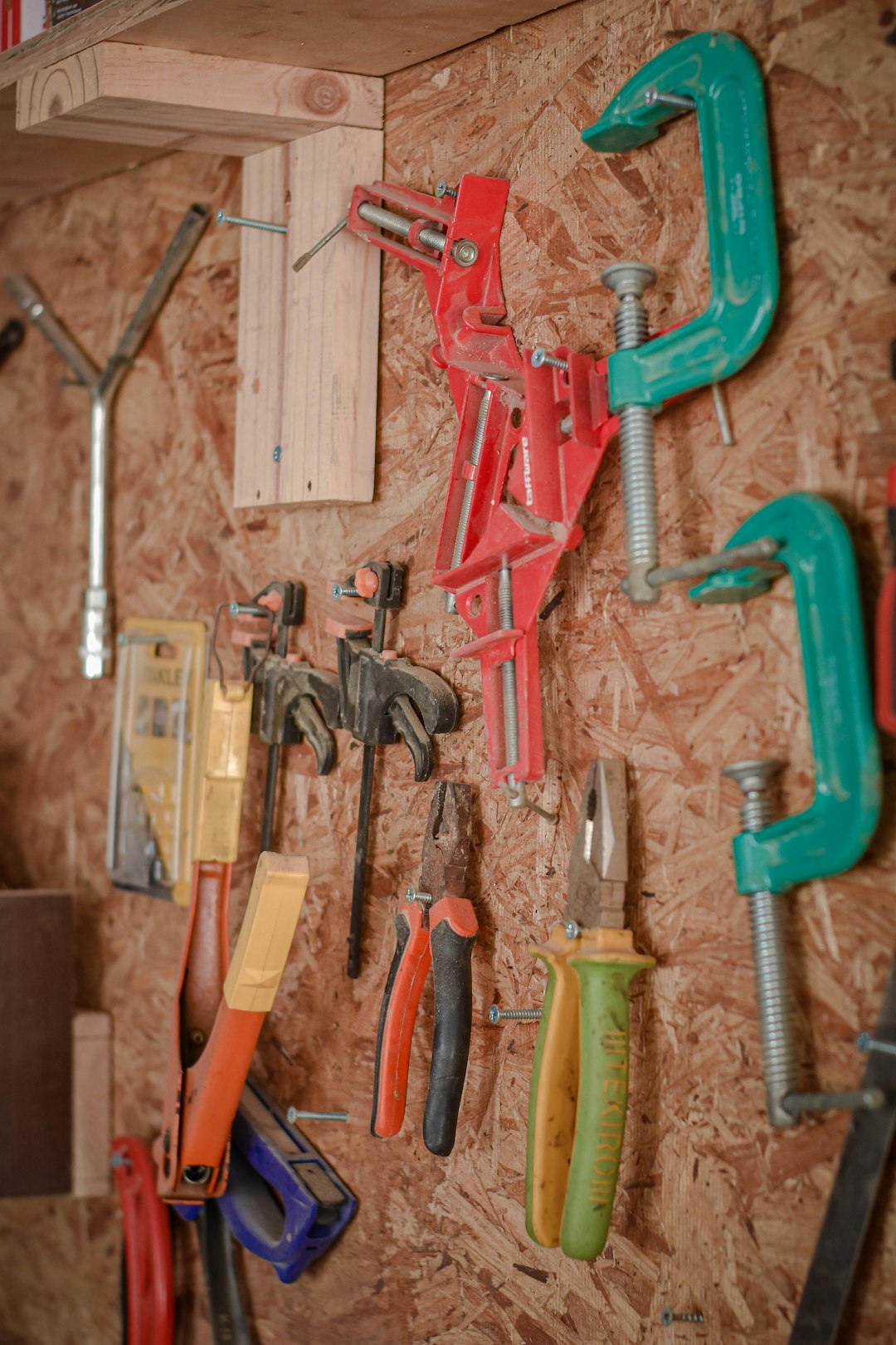 assorted-hand-tools-on-brown-wooden-wall-b7d1kb-j-4a